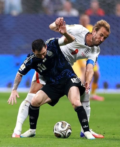 Argentina survive England scare to keep title defence alive